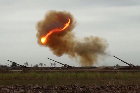 An image grab taken from a video made available on the official web site of the Azerbaijani Defence Ministry on September 28, 2020, allegedly shows Azeri artillery strike towards the positions of Armenian separatists in the breakaway region of Nagorno-Karabakh.  Handout / Azerbaijani Defence Ministry / AFP