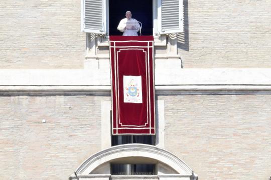 Pope Francis leads the Angelus prayer from the window of his office overlooking Saint Peter's Square at the Vatican, 06 March 2022. 