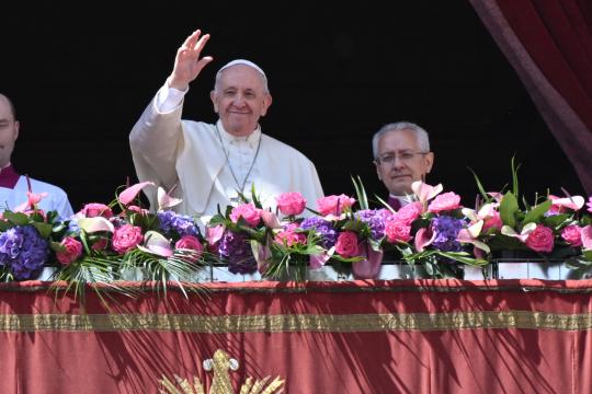 Pope Francis delivers the Easter "Urbi et Orbi" blessing from the balcony of St. Peter's Basilica overlooking St. Peter's square on April 17, 2022 in The Vatican. 