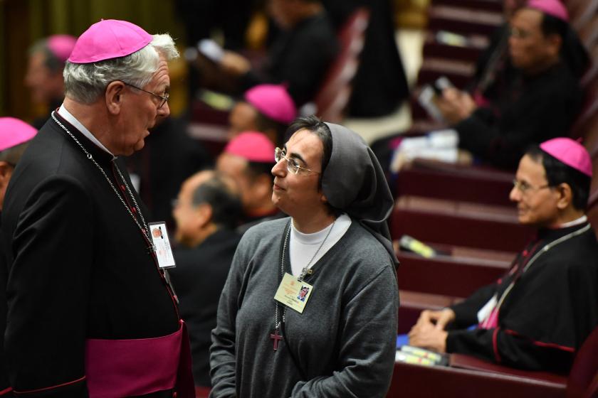 Belgian bishop Luc Van Looy (L) and Italian nun Alessandra Smerilli talk prior to the start of the Synod of Bishops, focusing on Young People, the Faith and Vocational Discernment, on October 3, 2018 at the Vatican. Andreas SOLARO / AFP