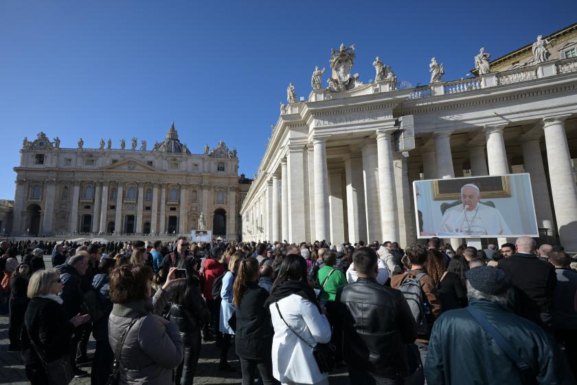 Pope Francis is seen on a giant screen at St. Peter's square in The Vatican as he delivers the Angelus prayer on December 3, 2023. Pope Francis's health is "improving," the Vatican said yesterday, after the pontiff was forced to cancel his attendance at the COP28 climate conference because of bronchitis. Even so, to avoid exposing him to temperature variations, the 86-year-old Argentinian recited the traditional Angelus Prayer from his private quarters. Tiziana FABI / AFP