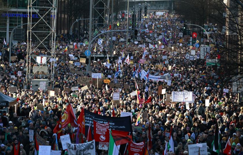 Protesters take part in a demonstration against racism and far-right politics on January 28, 2024 in Hamburg, northern Germany. Over a million people have joined marches in cities from Hamburg to Dresden to Stuttgart in protest at the Alternative for Germany (AfD) party over the last days. The wave of mobilisation was sparked by a January 10, 2024 report by investigative outlet Correctiv, which revealed that AfD members had discussed the expulsion of immigrants and "non-assimilated citizens" at a Potsdam me