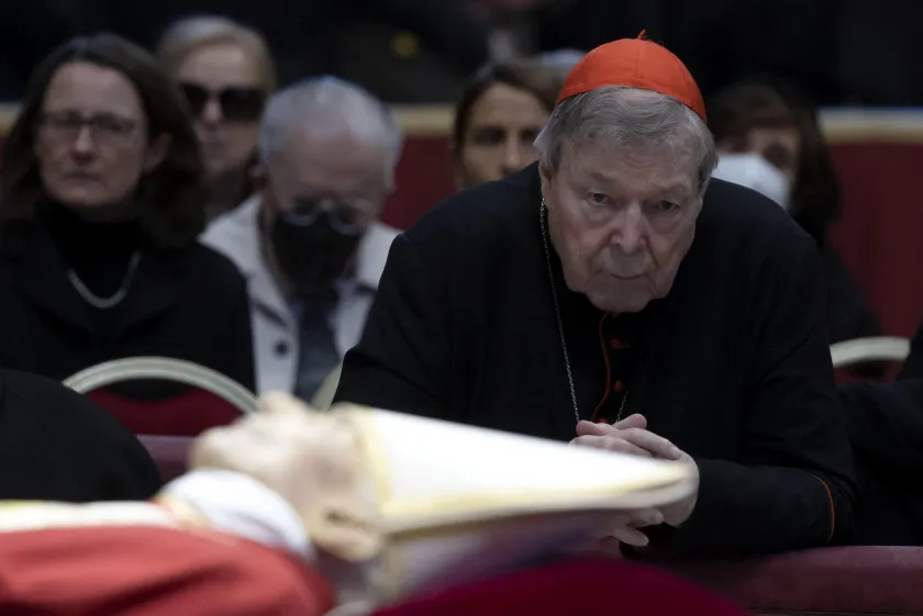 Australian Cardinal George Pell prays near the body of the late Pope Emeritus Benedict XVI (Joseph Ratzinger) lying in state in the Saint Peter Basilica for public viewing, Vatican City, 03 January 2023 (reissued 11 January 2023). According to a statement from the Catholic Archdiocese of Sydney, Cardinal George Pell died at age 81 on 11 January 2023 in Rome. EPA/MASSIMO PERCOSSI