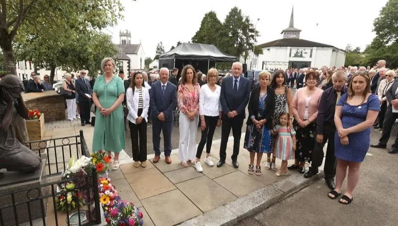 Bombing victim family members at a service in Claudy, Co Londonderry, to commemorate the nine people killed in three bomb blasts in the town in 1972. Picture date: Sunday July 31, 2022.
