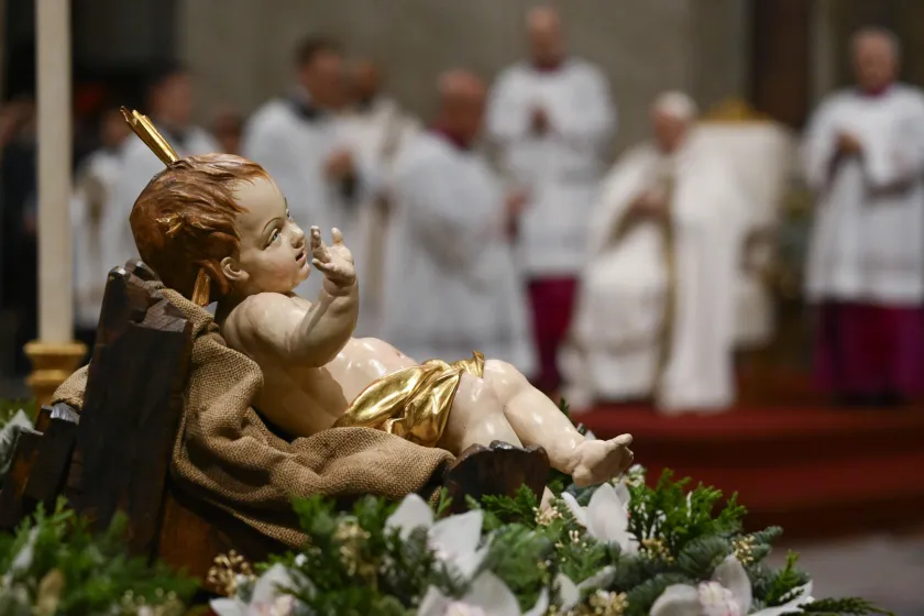handout picture provided by the Vatican Media shows Pope Francis (2-R) leads Midnight Mass of Christmas on the Solemnity of the Nativity of the Lord in Saint Peter's Basilica at the Vatican, 24 December 2023