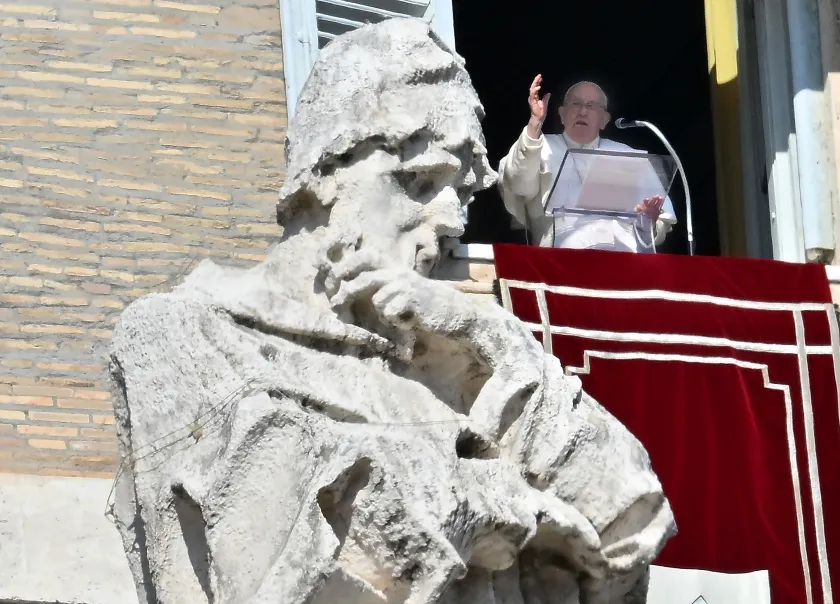 Pope Francis waves from the window of his study overlooking St. Peter's Square at the Vatican during the Angelus prayer on Febuary 18, 2024. Filippo MONTEFORTE / AFP